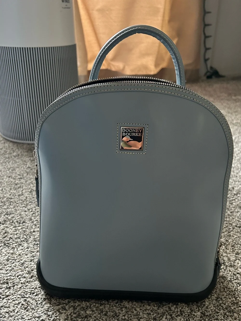Dooney & Bourke “Pod Backpack” light blue